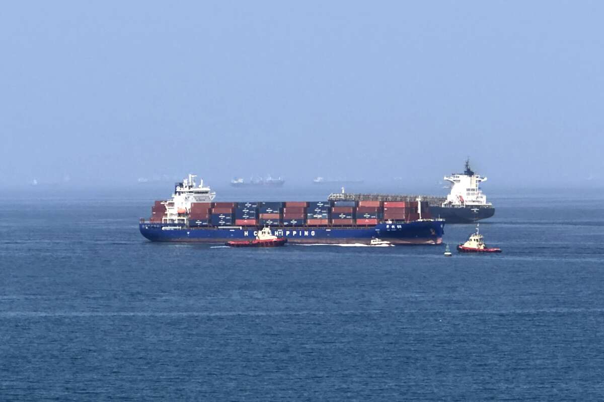 A cargo ship is pictured off coast of the Khor Fakkan Container Terminal along the Gulf of Oman on June 28, 2026.