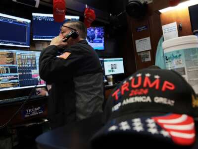 Traders work on the floor of the New York Stock Exchange during morning trading on April 13, 2026 in New York City. Stocks opened up lower after U.S. President Donald Trump ordered a U.S. blockade of the Strait of Hormuz following failed negotiations with Iran that sent oil prices back over $100 per barrel.