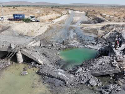 In this handout photo, a damaged bridge lies in a riverbed, following U.S. airstrikes carried out a day earlier, on July 17, 2026 in the southern Hormozgan Province, Iran.