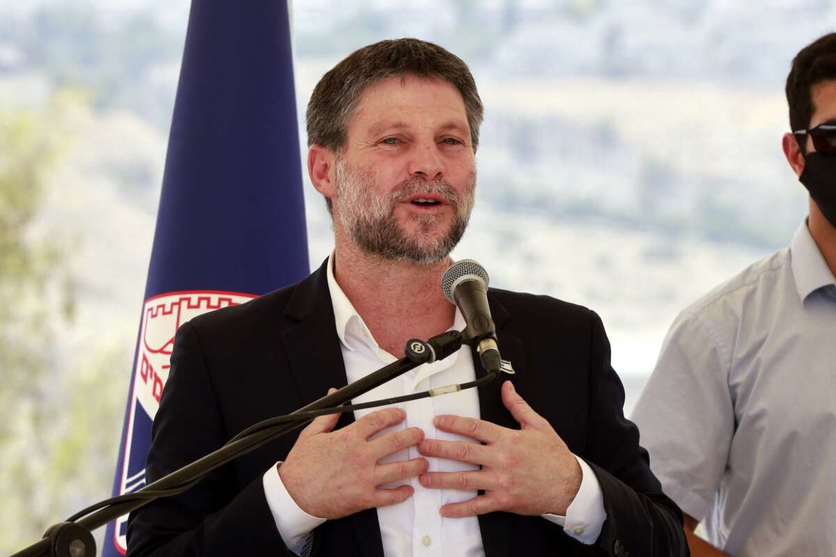 Israeli far-right Finance Minister Bezalel Smotrich speaks during a a press conference near the illegal settlement of Maale Adumim, outside Jerusalem in the occupied West Bank, on August 14, 2025.