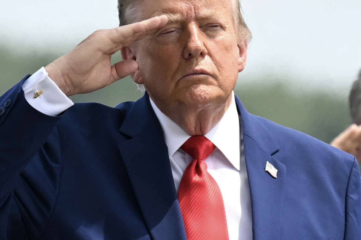 President Donald Trump salutes as he attends a dignified transfer solemn event for U.S service members killed during operations in the Middle East, at Dover Air Force Base in Dover, Delaware, on July 22, 2026.