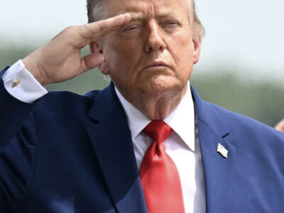 President Donald Trump salutes as he attends a dignified transfer solemn event for U.S service members killed during operations in the Middle East, at Dover Air Force Base in Dover, Delaware, on July 22, 2026.
