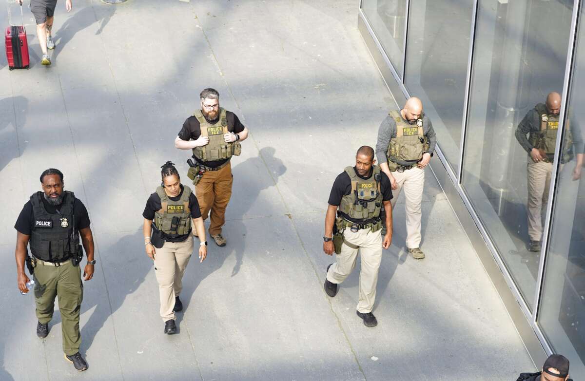 Immigration and Customs Enforcement (ICE) agents patrol Atlanta Hartsfield-Jackson International Airport on March 23, 2026 in Atlanta, Georgia.