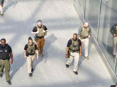 Immigration and Customs Enforcement (ICE) agents patrol Atlanta Hartsfield-Jackson International Airport on March 23, 2026 in Atlanta, Georgia.