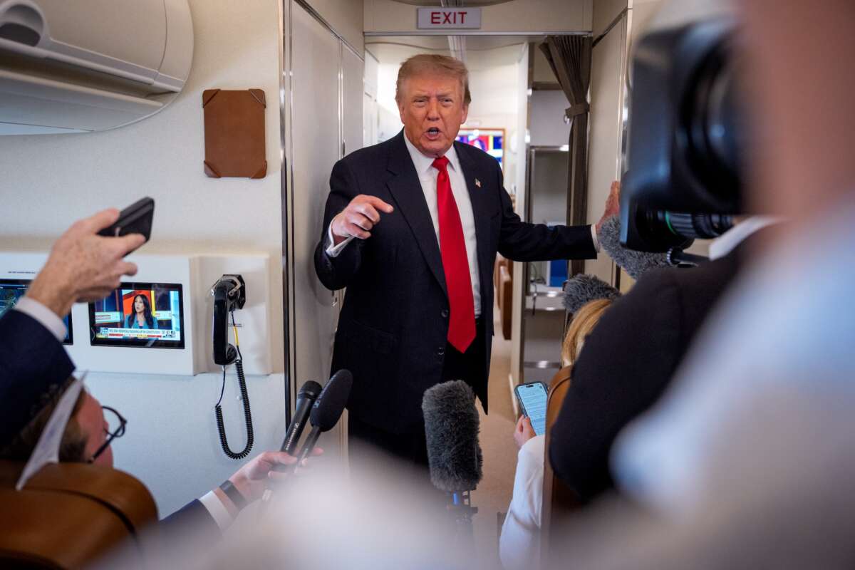 U.S. President Donald Trump speaks while aboard Air Force One for a trip to Michigan on July 27, 2026 in flight.