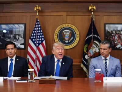 President Donald Trump, alongside Secretary of State Marco Rubio (L) and Secretary of Defense Pete Hegseth (R), speaks during a Cabinet meeting at Camp David in Maryland, on July 31, 2026.