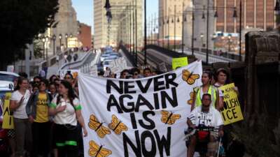 Anti-ICE protesters march across the Longfellow Bridge between Boston and Cambridge, Massachusetts, toward Amazon's Cambridge office after rallying at the New England Holocaust Memorial on September 5, 2019. The protest was planned by Never Again Action, a nationwide group of Jewish activists that formed to protest private companies doing business with ICE.