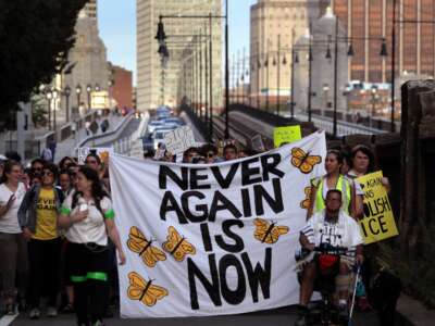 Anti-ICE protesters march across the Longfellow Bridge between Boston and Cambridge, Massachusetts, toward Amazon's Cambridge office after rallying at the New England Holocaust Memorial on September 5, 2019. The protest was planned by Never Again Action, a nationwide group of Jewish activists that formed to protest private companies doing business with ICE.