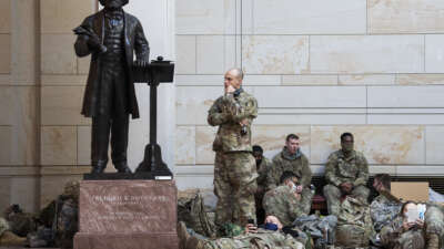 Members of the National Guard are seen near a statue of Frederick Douglass in the Capitol Visitor Center as the House debates an article of impeachment against President Donald Trump on January 13, 2021, in Washington, D.C.