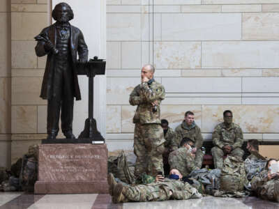 Members of the National Guard are seen near a statue of Frederick Douglass in the Capitol Visitor Center as the House debates an article of impeachment against President Donald Trump on January 13, 2021, in Washington, D.C.