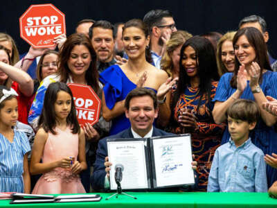 Florida Gov. Ron DeSantis reacts after signing HB 7, also dubbed the “Stop Woke Act,” at Mater Academy Charter Middle/High School in Hialeah Gardens, Florida, on April 22, 2022.