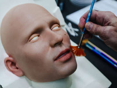 Founder Matt McMullen works on the face of a robot at the workshop for Realbotix, a company that makes life-like AI driven robots, in Las Vegas, January 17, 2024.