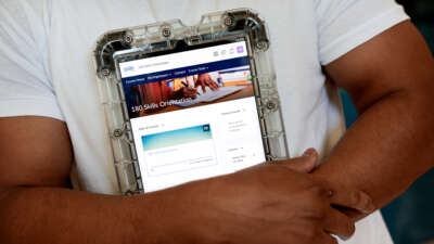 An incarcerated person displays a program and educational tablet supplied by the Department of Corrections at the Massachusetts Correctional Institution in Norfolk, Massachusetts, on May 24, 2024.