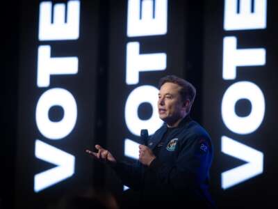 Elon Musk speaks during a town hall meeting at the KI Convention Center in Green Bay, Wisconsin, on March 30, 2025.