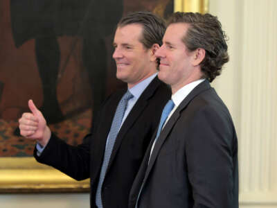 Tyler and Cameron Winklevoss attend the signing ceremony for the “GENIUS Act” in the East Room of the White House on July 18, 2025, in Washington, D.C.