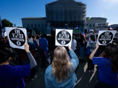 Voting rights activists protest outside the Supreme Court as the court prepares to hear arguments in a case challenging Louisiana's congressional map, in Washington, D.C., on October 15, 2025.