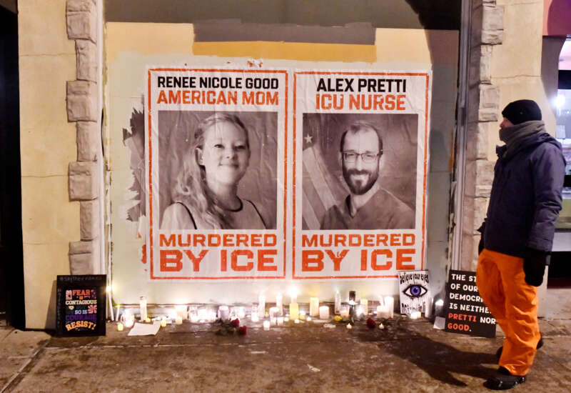 Posters of Renee Nicole Good and Alex Pretti, both US citizens fatally shot by immigration agents, are seen during a candlelight vigil in Minneapolis, Minnesota, on January 28, 2026.