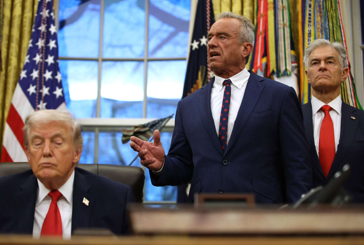 President Donald Trump shuts his eyes as Secretary of Health and Human Services Robert F. Kennedy Jr. speaks and Medicaid Services Mehmet Oz looks on in the Oval Office at the White House on January 29, 2026, in Washington, D.C.