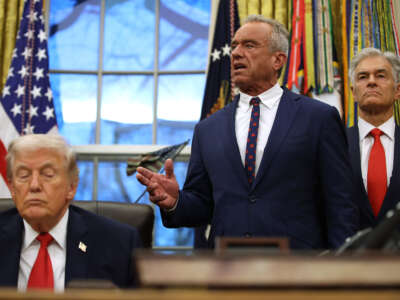 President Donald Trump shuts his eyes as Secretary of Health and Human Services Robert F. Kennedy Jr. speaks and Medicaid Services Mehmet Oz looks on in the Oval Office at the White House on January 29, 2026, in Washington, D.C.