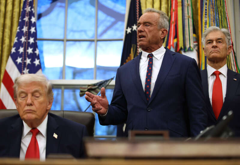 President Donald Trump shuts his eyes as Secretary of Health and Human Services Robert F. Kennedy Jr. speaks and Medicaid Services Mehmet Oz looks on in the Oval Office at the White House on January 29, 2026, in Washington, D.C.