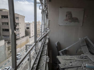 An image of a newborn baby is photographed at the Gandhi Hospital, which is damaged after U.S.-Israeli strikes on a state TV telecommunication tower nearby in Tehran, Iran, on March 2, 2026.