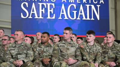 Members of the U.S. military listen as Donald Trump speaks during the Memphis Safe Task Force roundtable in Memphis, Tennessee, on March 23, 2026.