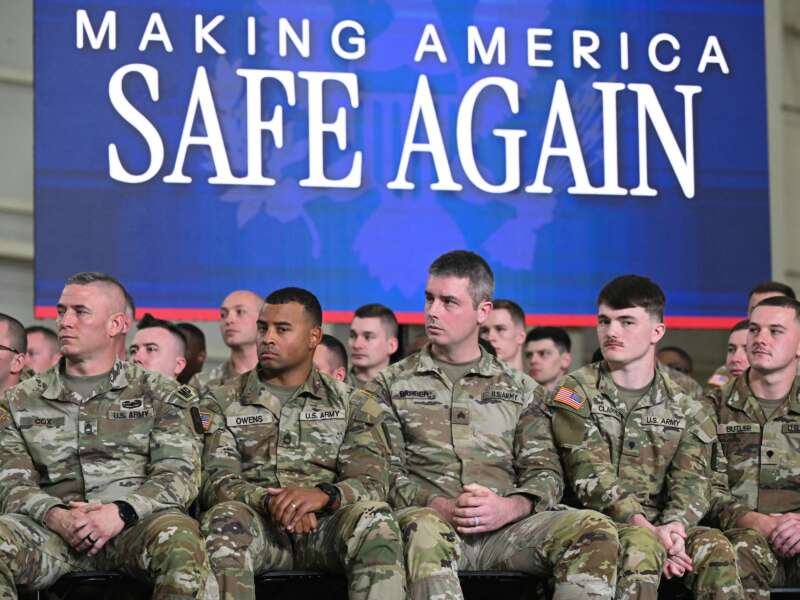 Members of the U.S. military listen as Donald Trump speaks during the Memphis Safe Task Force roundtable in Memphis, Tennessee, on March 23, 2026.