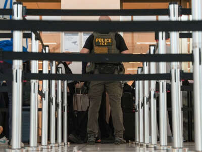 An ICE agent “assists” TSA agents at a security checkpoint in LaGuardia Airport, on March 28, 2026, in New York, New York.