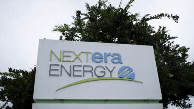 The logo of NextEra Energy is seen at the entrance of its headquarters on May 18, 2026, in Juno Beach, Florida.