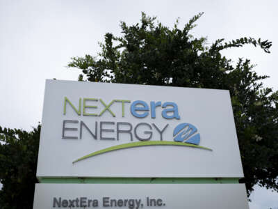 The logo of NextEra Energy is seen at the entrance of its headquarters on May 18, 2026, in Juno Beach, Florida.