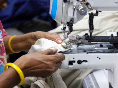 A woman uses a sewing and stitching machine in Kolkata, India, on June 11, 2026.