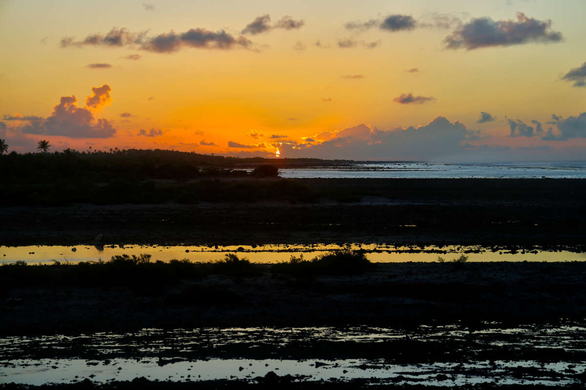 Sunrise over a coral reef where the ocean tide has receded in Tikehau, French Polynesia, on May 28, 2026. Tikehau, also known as Porutu-kai, is a coral atoll in the Palliser Islands group, part of the Tuamotu Archipelago in French Polynesia.