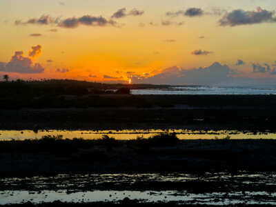 Sunrise over a coral reef where the ocean tide has receded in Tikehau, French Polynesia, on May 28, 2026. Tikehau, also known as Porutu-kai, is a coral atoll in the Palliser Islands group, part of the Tuamotu Archipelago in French Polynesia.