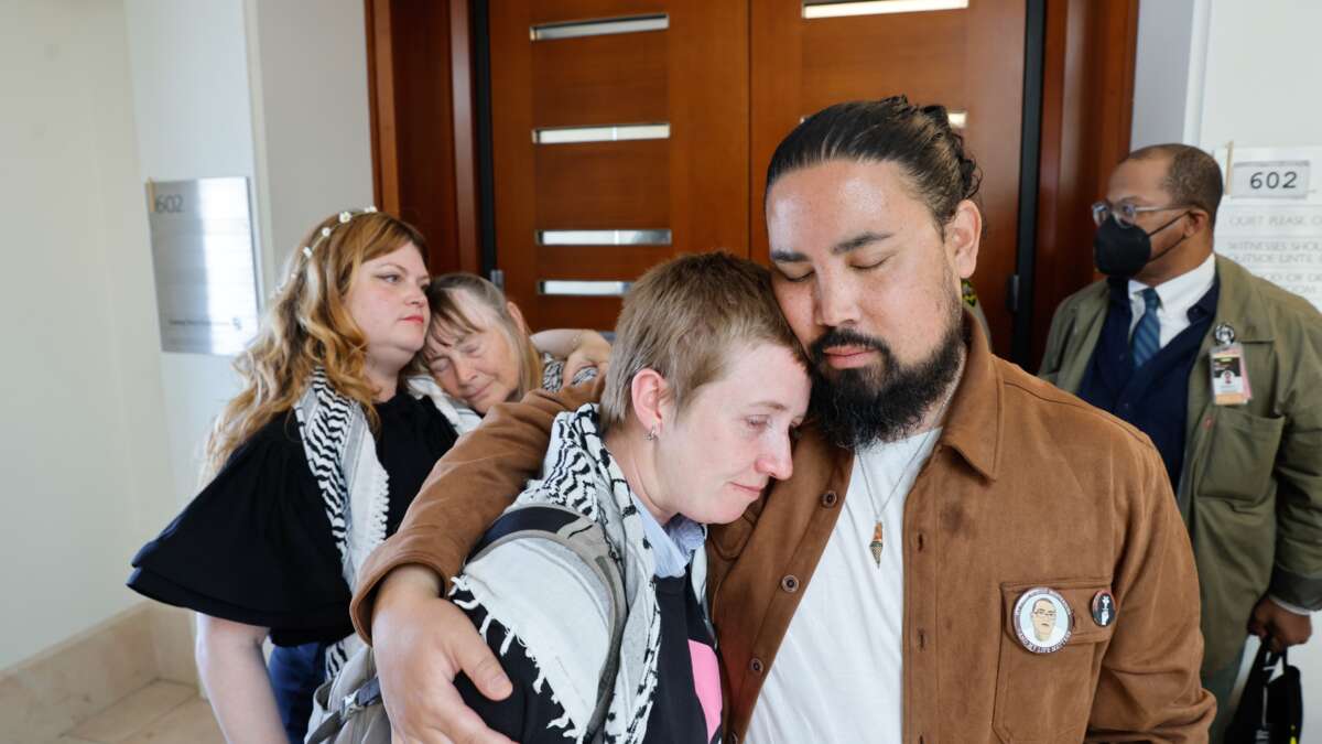 Golden Gate Bridge trial defendant Em Titllotson, front left, is embraced by supporter Josh Reyes, front right, as defendant Sarah Cantor, back left, and her mother Laurie Moorehead, back second from left, hug as Tillotson and Cantor leave the courtroom on July 2, 2026, in San Francisco, California.