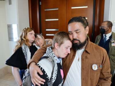 Golden Gate Bridge trial defendant Em Titllotson, front left, is embraced by supporter Josh Reyes, front right, as defendant Sarah Cantor, back left, and her mother Laurie Moorehead, back second from left, hug as Tillotson and Cantor leave the courtroom on July 2, 2026, in San Francisco, California.