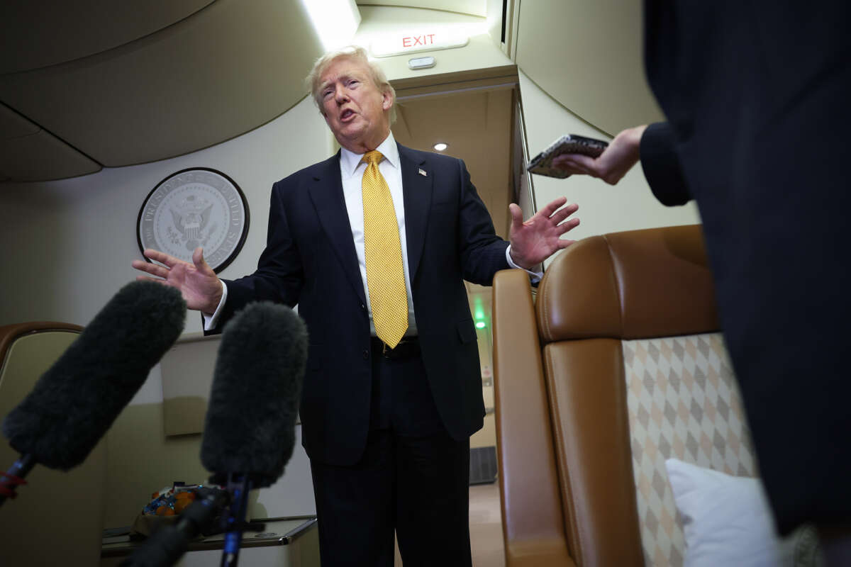 U.S. President Donald Trump speaks to members of the press for the first time aboard the new Air Force One while in flight from RAF Mildenhall AFB to Joint Base Andrews on July 8, 2026, after leaving the United Kingdom.
