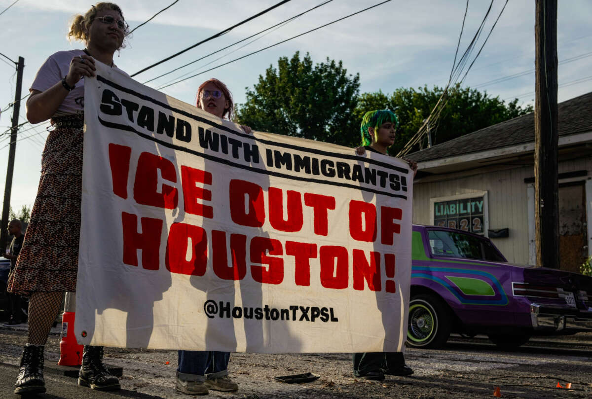 Hundreds of demonstrators gather in Houston's Magnolia Park neighborhood for a protest, march, and candlelight vigil following the shooting of Lorenzo Salgado Araujo by a federal agent during a federal immigration enforcement operation in Houston, Texas, on July 8, 2026.