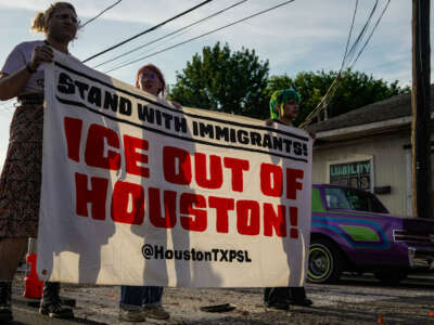 Hundreds of demonstrators gather in Houston's Magnolia Park neighborhood for a protest, march, and candlelight vigil following the shooting of Lorenzo Salgado Araujo by a federal agent during a federal immigration enforcement operation in Houston, Texas, on July 8, 2026.
