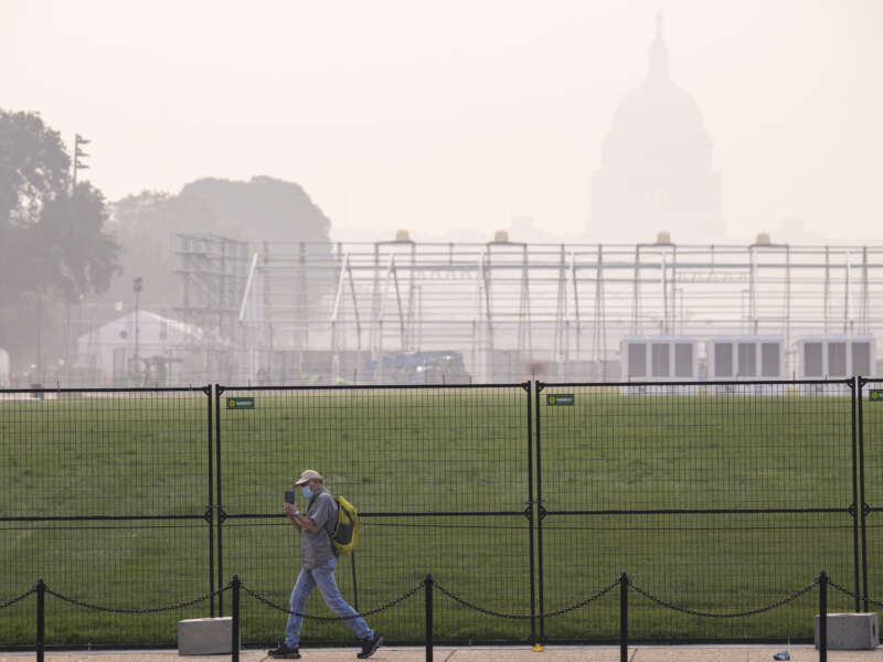 Smoke from massive wildfires in Canada and Minnesota engulfs the Washington, D.C. skyline, reducing visibility and casting a colored haze over the U.S. Capitol Building on July 17, 2026, in Washington, D.C.