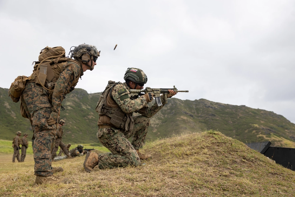 U.S. Marines join Ecuadorian Marines in fire team maneuvers at Marine Corps Base Hawaii during RIMPAC 2024.