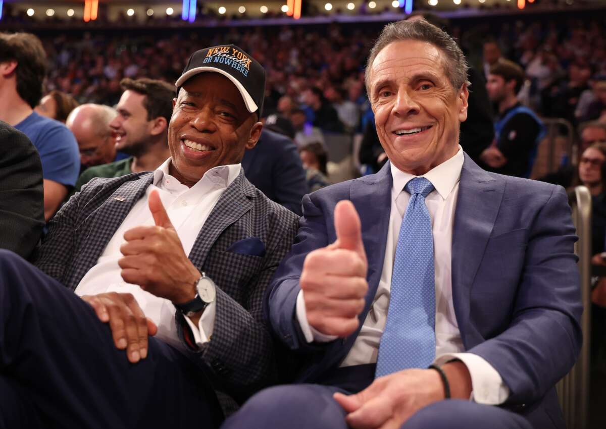 New York Mayor Eric Adams poses with then-mayoral candidate former New York Gov. Andrew Cuomo during the game between the New York Knicks and the Cleveland Cavaliers at Madison Square Garden on October 22, 2025 in New York City.