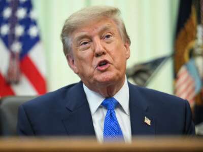 President Donald Trump speaks before signing an executive order calling for more research and flexibility on vaccines, in the Oval Office of the White House in Washington, DC, on August 10, 2026.