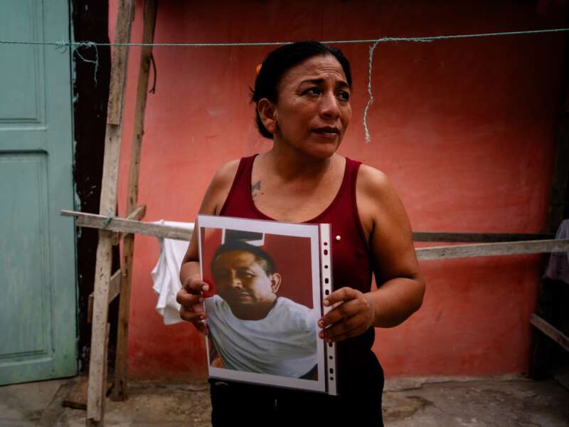 María Mero, 42, holds a photograph of her husband, Gabriel Aladono Mero Delgado, 43, who disappeared as part of the crew aboard the fishing vessel Fiorella, on Sunday, June 7, 2026 in Jaramijó, Ecuador.