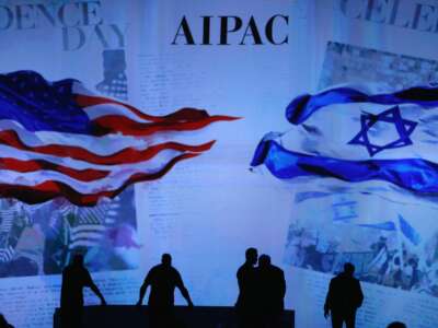 Workers prepare the stage before for Israeli Prime Minister Benjamin Netanyahu address to the American Israel Public Affairs Committee (AIPAC) 2015 Policy Conference, March 2, 2015 in Washington, D.C.