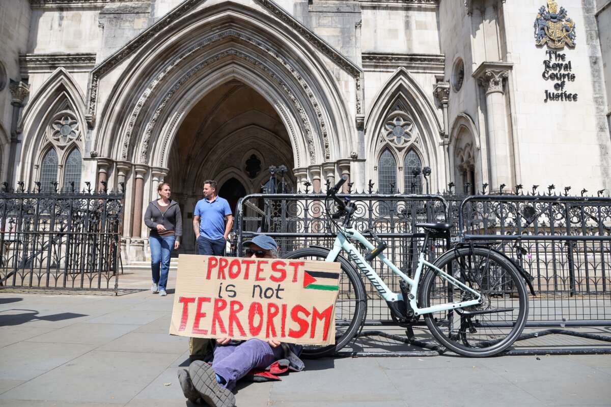 A supporter of Palestine Action demonstrates outside the Royal Courts of Justice as the government appeals the high court ruling that the ban on the activist group Palestine Action is unlawful on April 28, 2026.