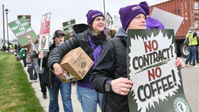 Starbucks Workers United baristas and supporters close off road and rally for a fair union contract outside Starbucks East Coast distribution center on November 19, 2025, in York, Pennsylvania.