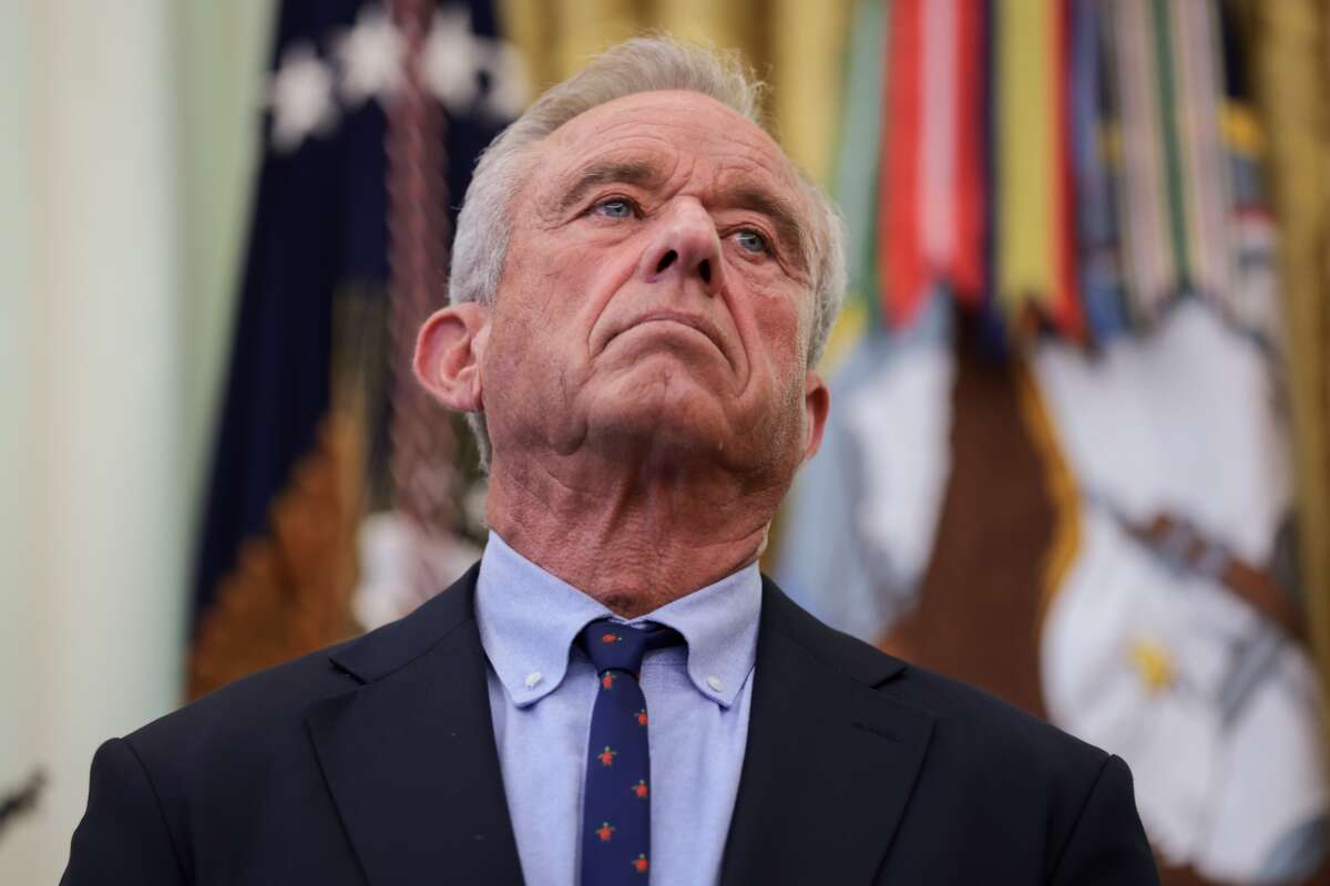 Health and Human Services Secretary Robert F. Kennedy Jr. joins U.S. President Donald Trump as he signs an executive order on childhood vaccines during an event in the Oval Office of the White House on August 10, 2026 in Washington, D.C.