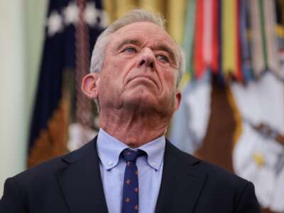 Health and Human Services Secretary Robert F. Kennedy Jr. joins U.S. President Donald Trump as he signs an executive order on childhood vaccines during an event in the Oval Office of the White House on August 10, 2026 in Washington, D.C.