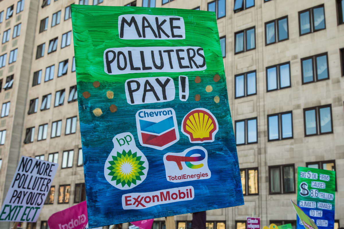 Climate justice campaigners march from the Shell Centre to Trafalgar Square to demand urgent climate finance and reparations for loss and damage for global south communities on November 12, 2022, in London, United Kingdom.