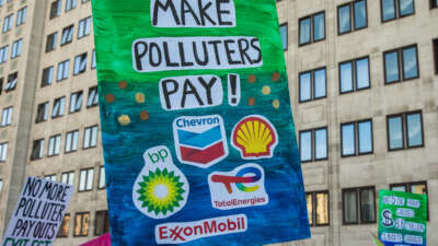 Climate justice campaigners march from the Shell Centre to Trafalgar Square to demand urgent climate finance and reparations for loss and damage for global south communities on November 12, 2022, in London, United Kingdom.